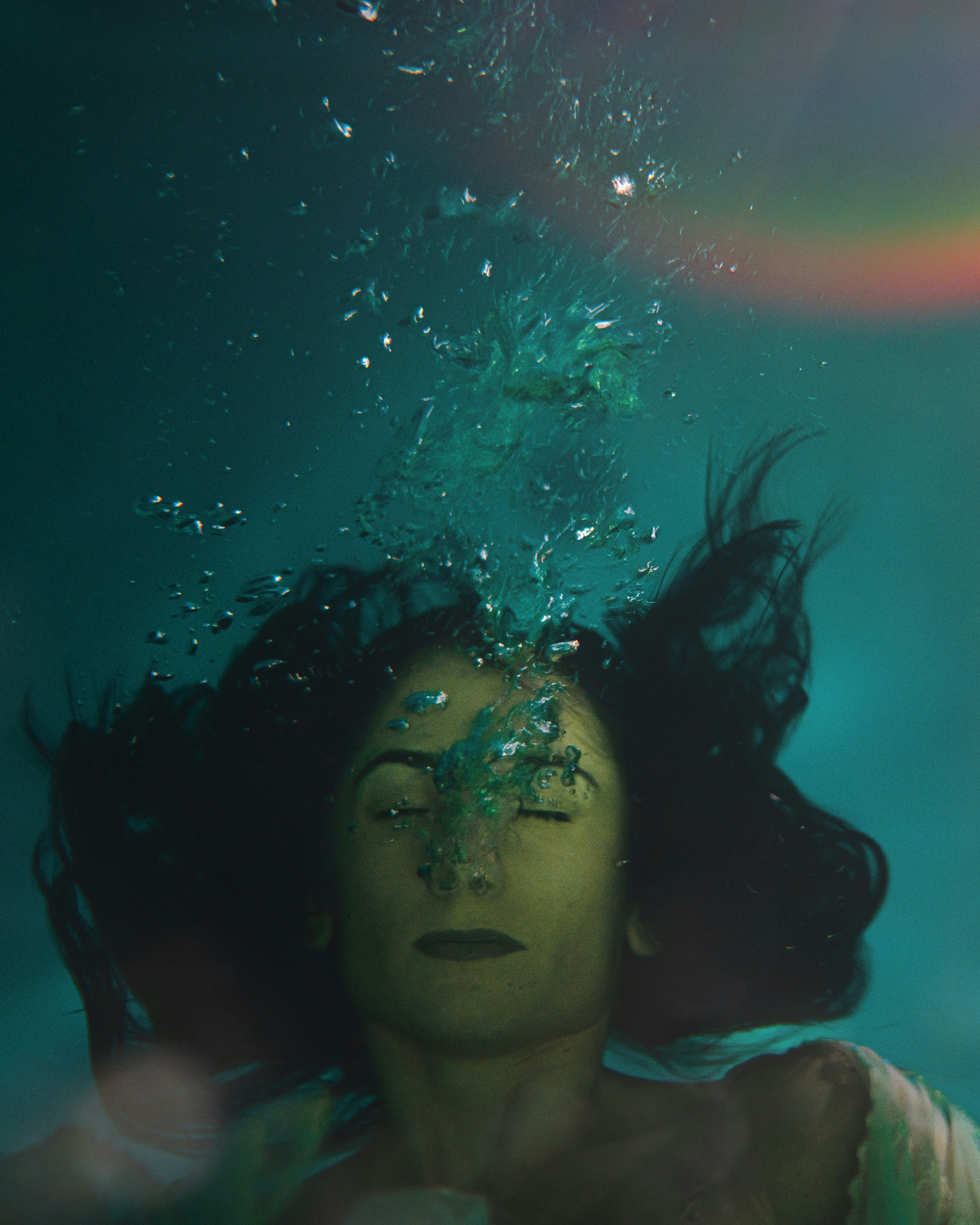 camille barber add woman underwater in tank photo