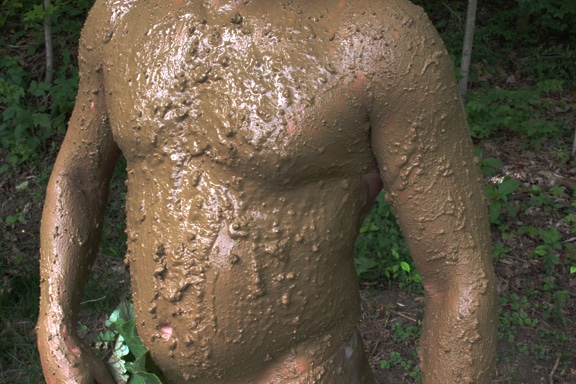 naked men in mud