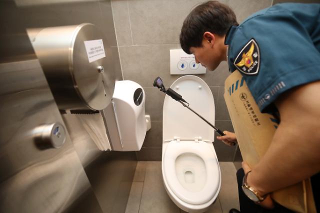 asif hoque recommends hidden camera in public restroom pic