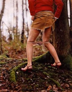 girl peeing in woods