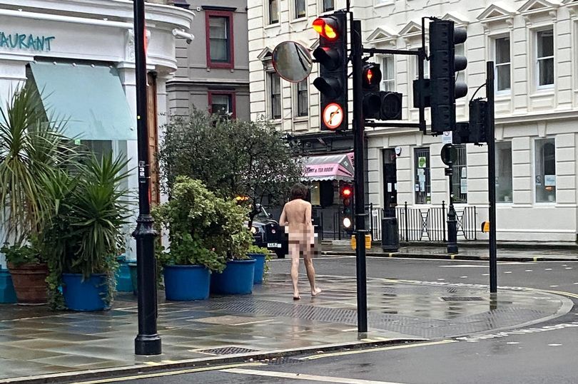 adeniran add walking down street naked photo
